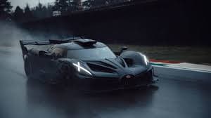 Bugatti Bolide hypercar, a black track-focused concept vehicle with extreme aerodynamic styling and distinctive 'X'-shaped headlights, captured in motion on a wet racetrack.
