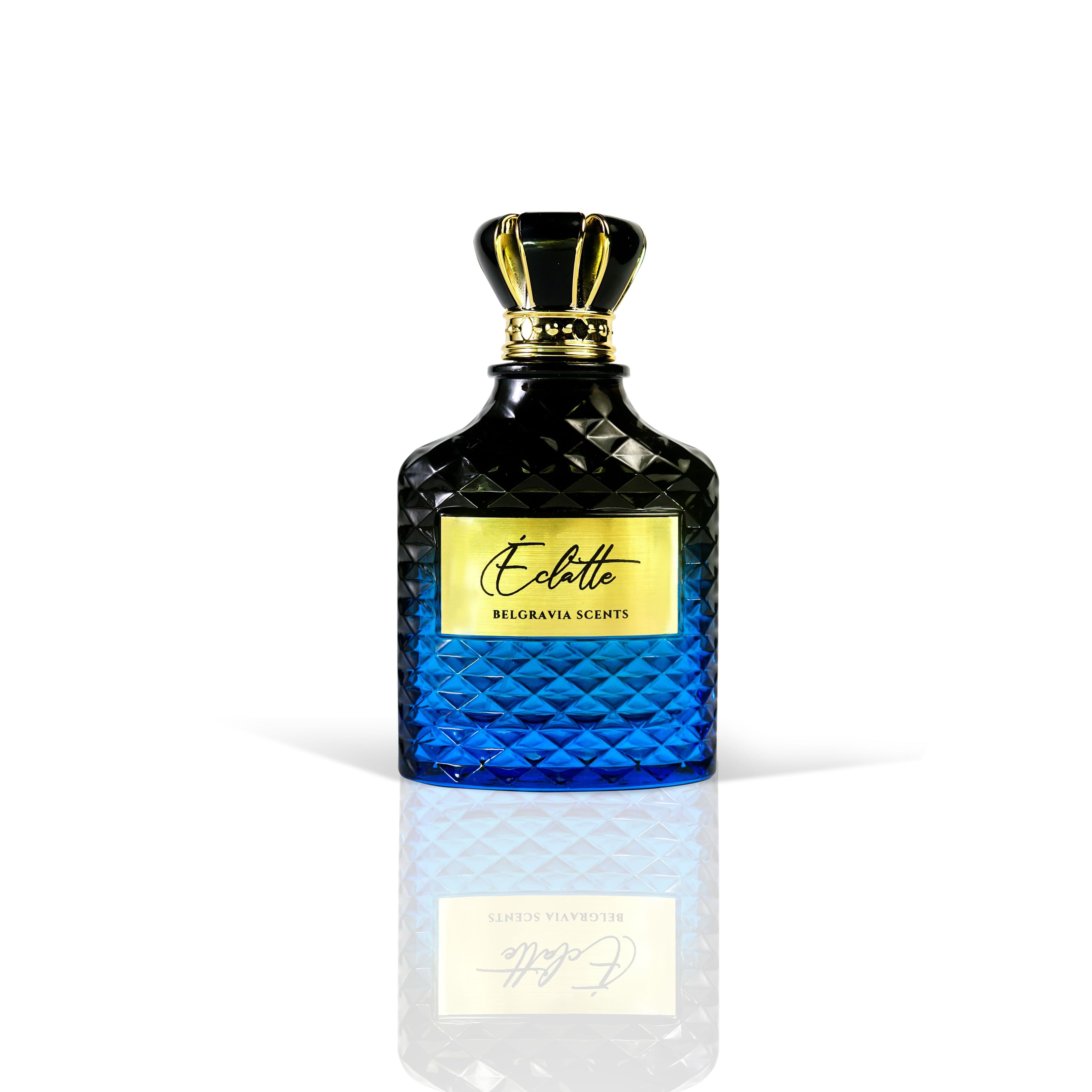 A luxurious perfume bottle with a faceted glass body that transitions from dark blue to bright blue, an ornate gold and black crown-like cap, and a gold label