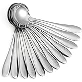 Set of stainless steel soup spoons or serving spoons, stacked neatly